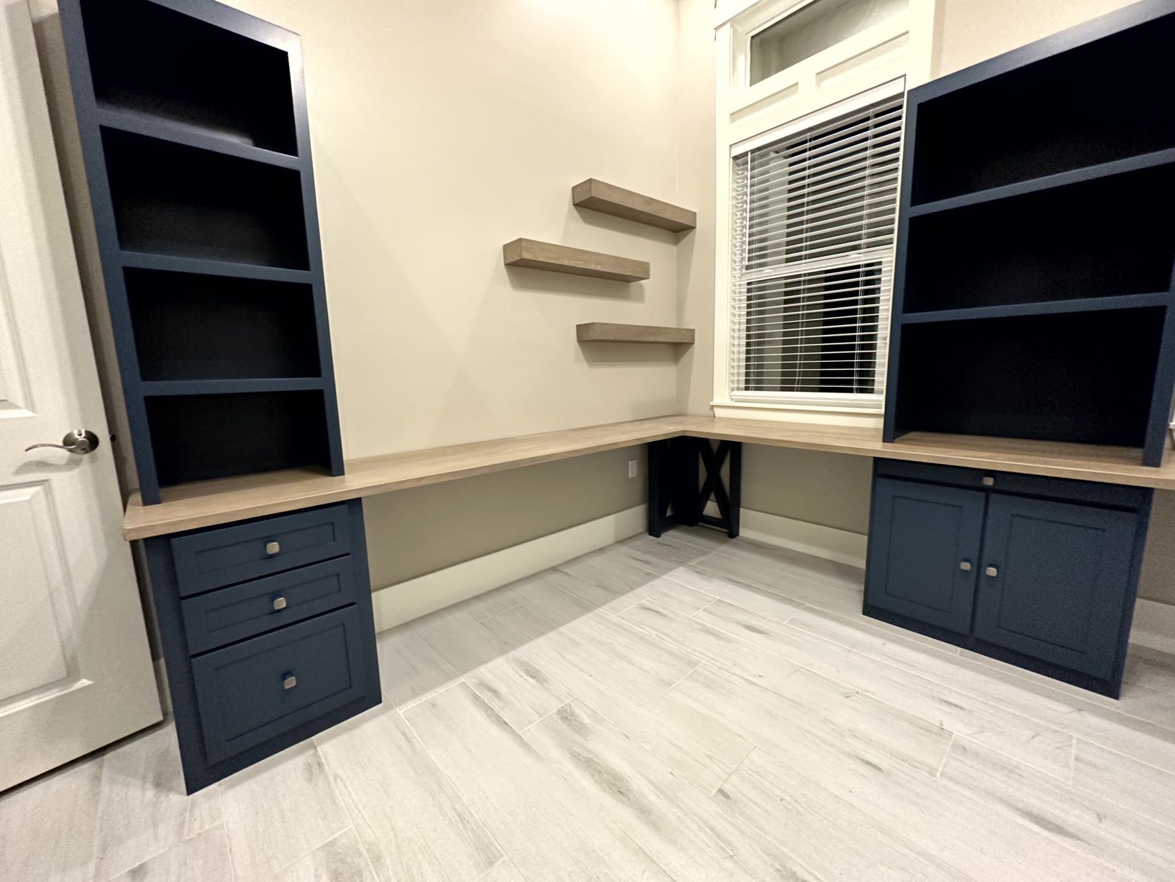 Custom navy built-in office desk with honey wood top